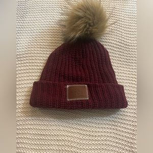 Woman’s maroon love your Mellon knit winter hat